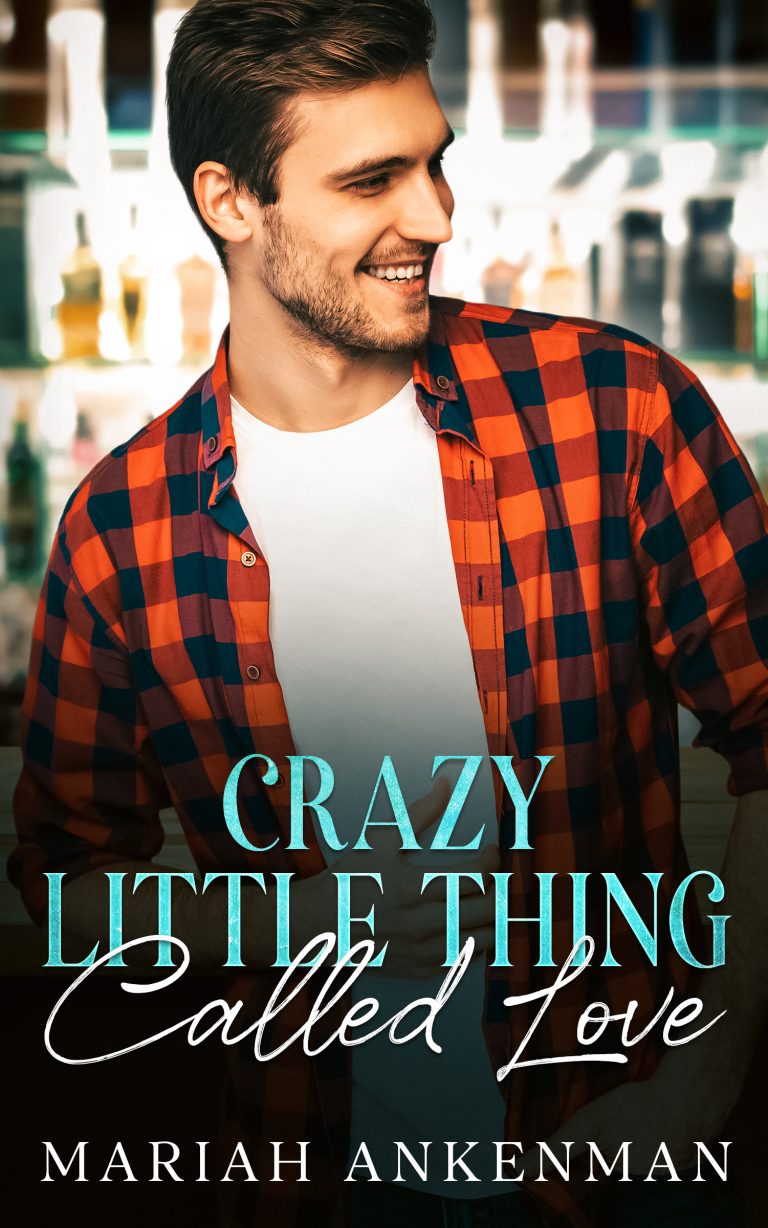 Smiling man in red flannel with a bar behind him and text: Crazy Little Thing Called Love by Mariah Ankenman